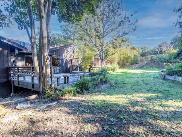 view of yard with a wooden deck