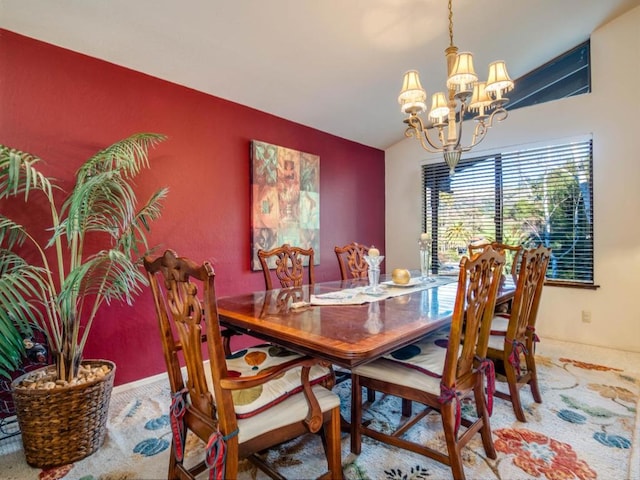 dining room featuring vaulted ceiling, carpet, and a chandelier