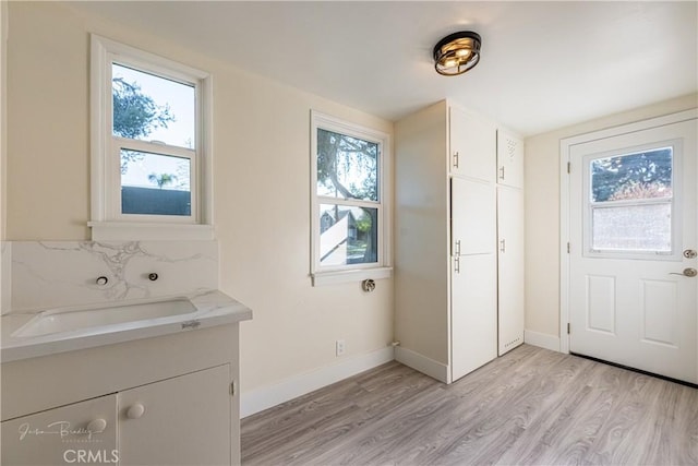 bathroom featuring hardwood / wood-style floors and vanity