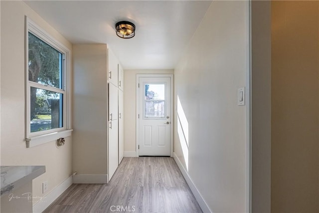 entryway with light hardwood / wood-style floors