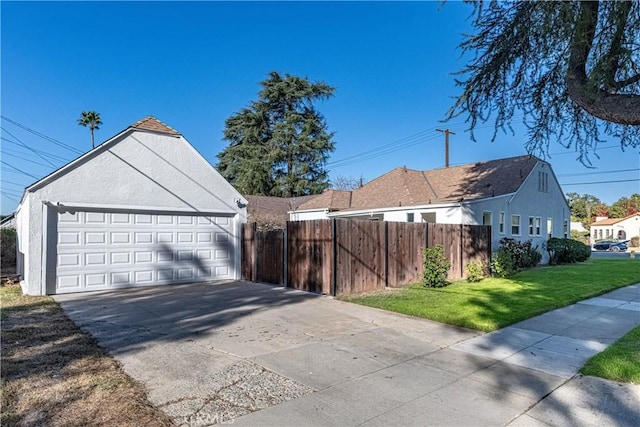 exterior space with a yard and a garage