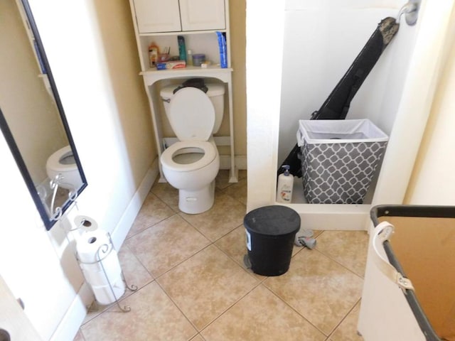 bathroom featuring tile patterned flooring and toilet