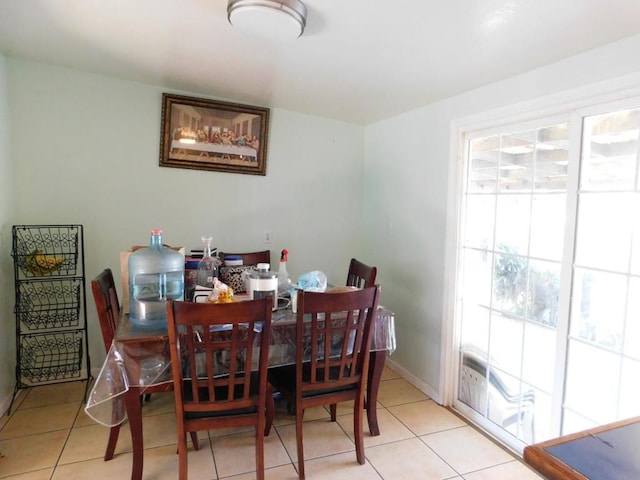 dining room featuring light tile patterned floors