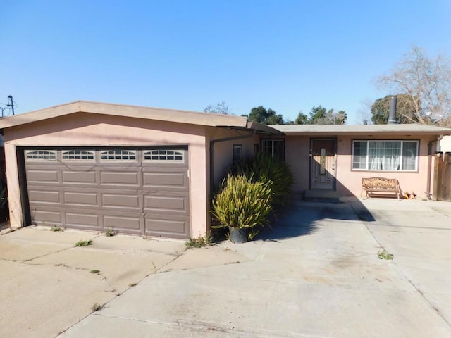 single story home featuring a garage