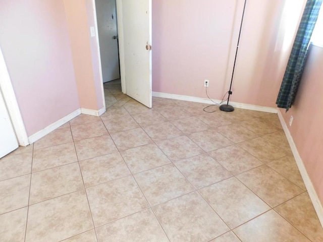 spare room with light tile patterned flooring