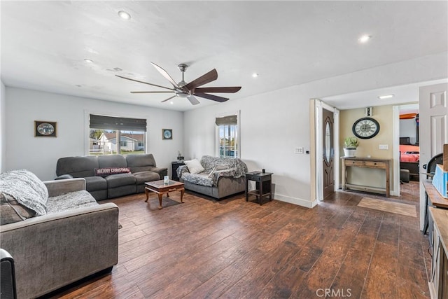 living room featuring dark hardwood / wood-style floors and ceiling fan