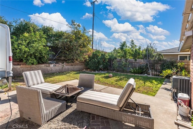 view of patio / terrace featuring a fire pit and central air condition unit