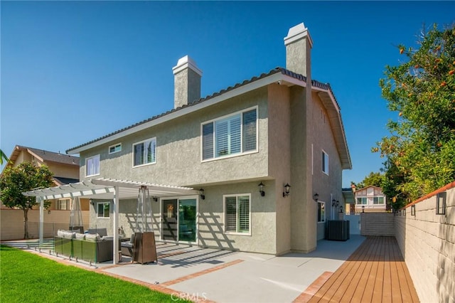 back of house with a patio area, a pergola, and central air condition unit