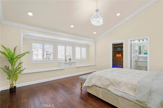 bedroom featuring ensuite bathroom, vaulted ceiling, and ornamental molding