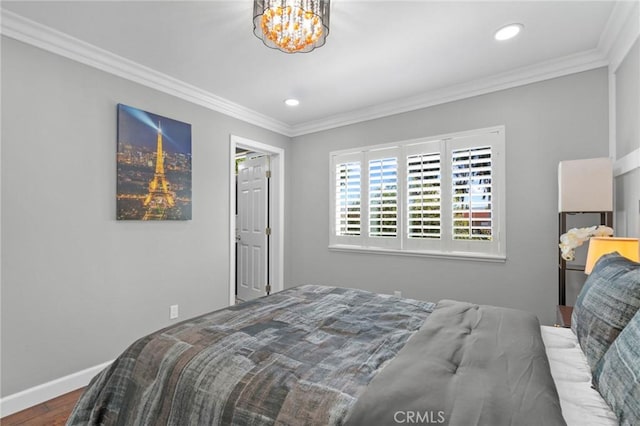 bedroom featuring crown molding and hardwood / wood-style flooring