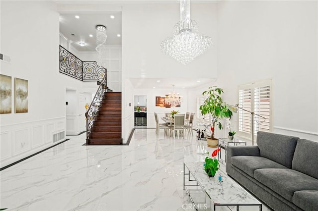 living room with crown molding and a high ceiling