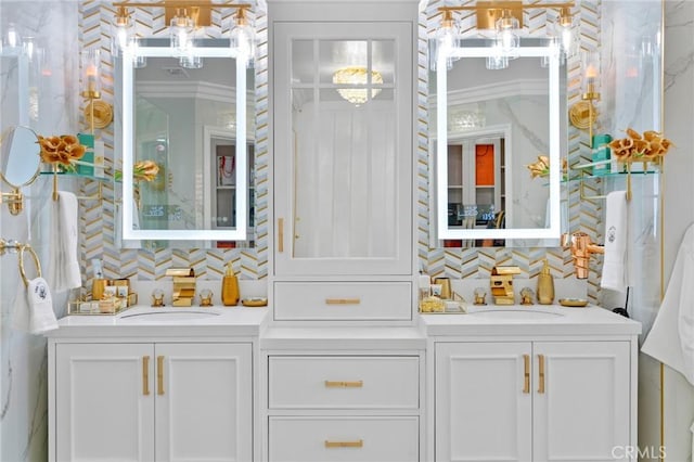 bathroom with tasteful backsplash, crown molding, and vanity