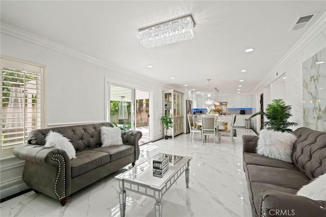 living room with ornamental molding and an inviting chandelier