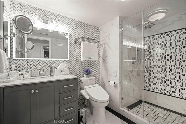 bathroom featuring tasteful backsplash, an enclosed shower, vanity, tile walls, and toilet