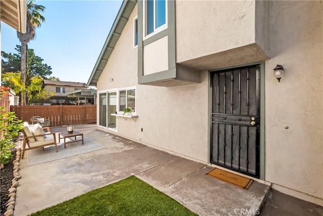 doorway to property featuring a patio