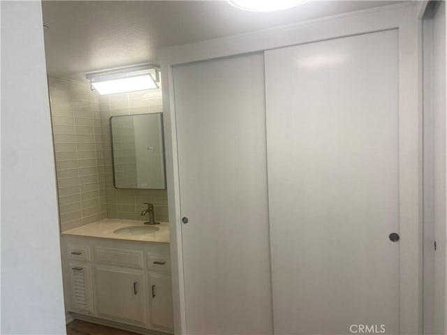 bathroom featuring backsplash and vanity