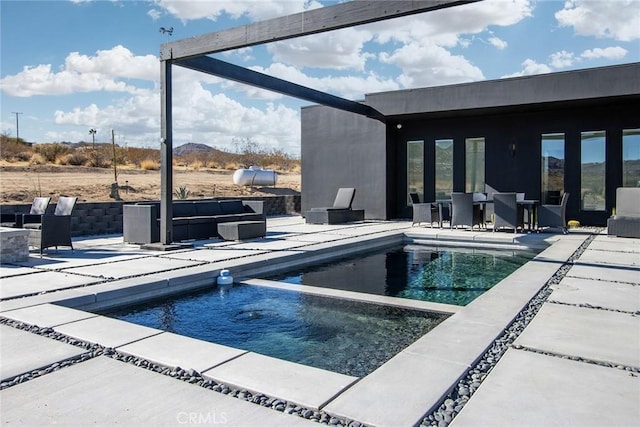 view of swimming pool featuring a patio area and an outdoor hangout area