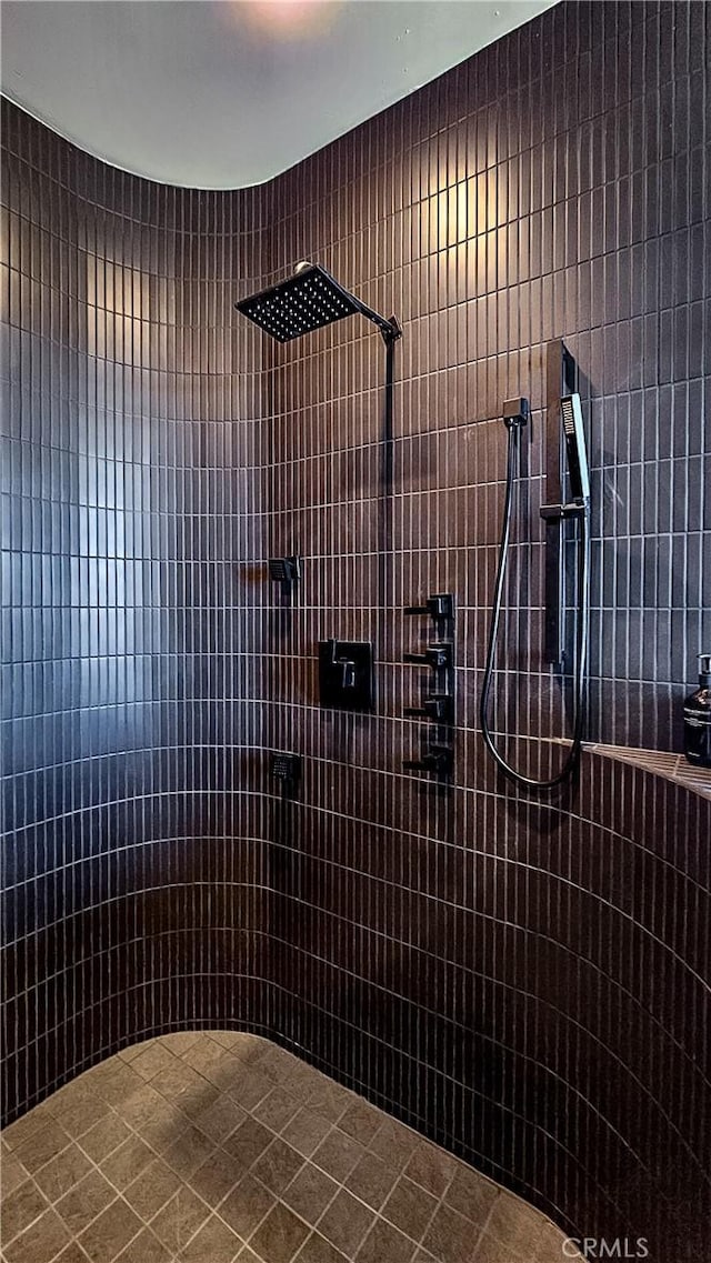 bathroom with a tile shower