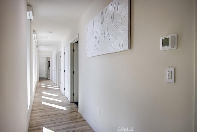 corridor featuring light wood-type flooring