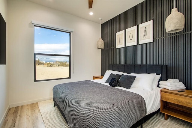 bedroom with wood-type flooring