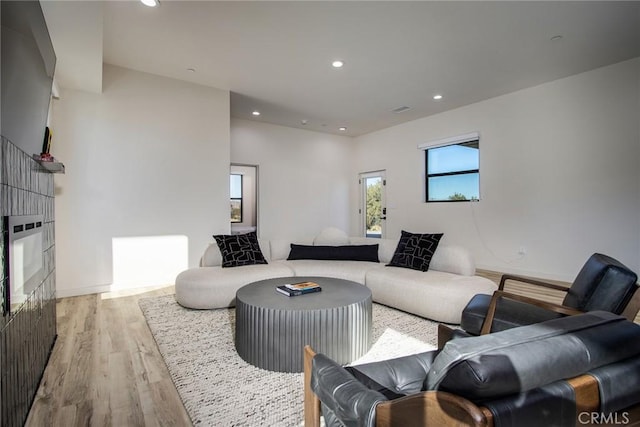 living room with light hardwood / wood-style flooring