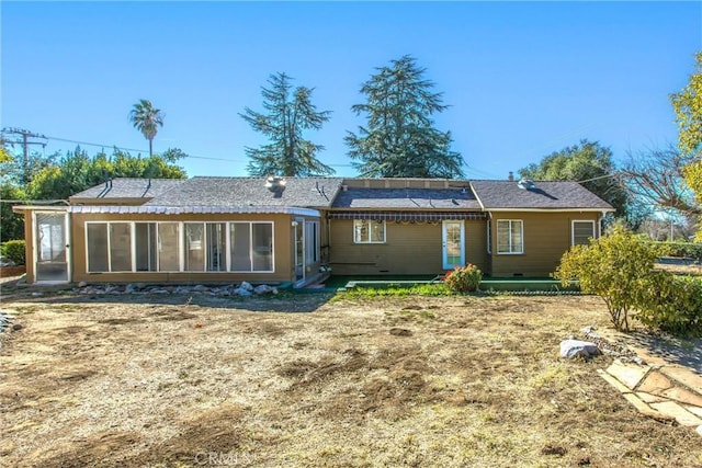 back of property featuring a sunroom