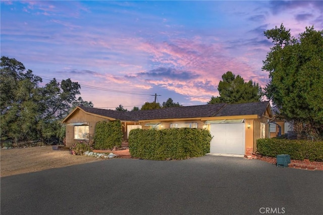 ranch-style home with a garage