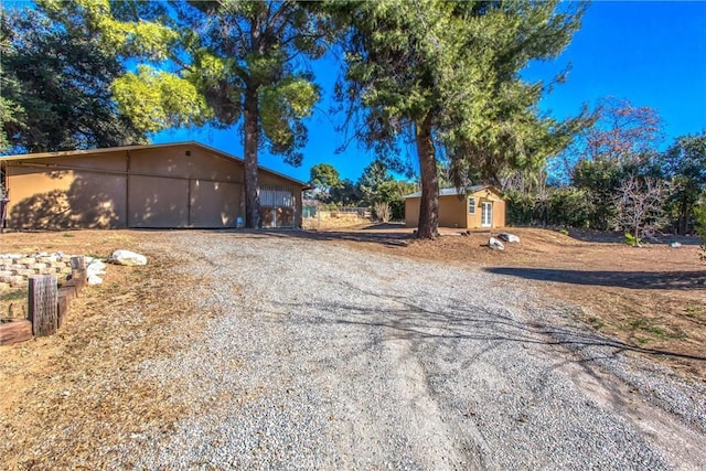 view of front of home featuring an outbuilding