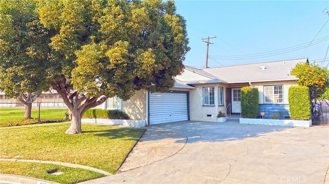 ranch-style home featuring a garage and a front lawn