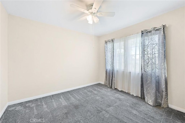 empty room featuring carpet and ceiling fan