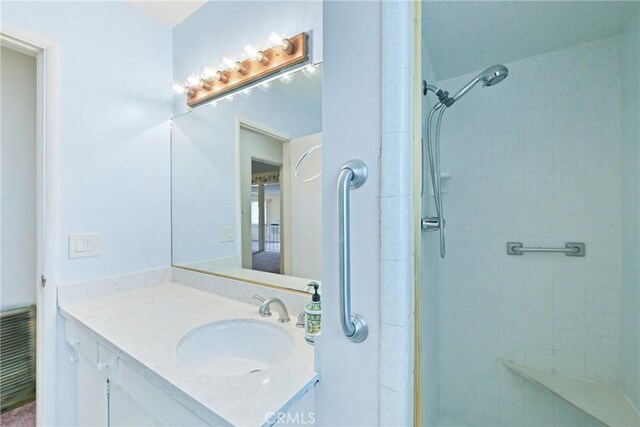 bathroom featuring vanity and walk in shower