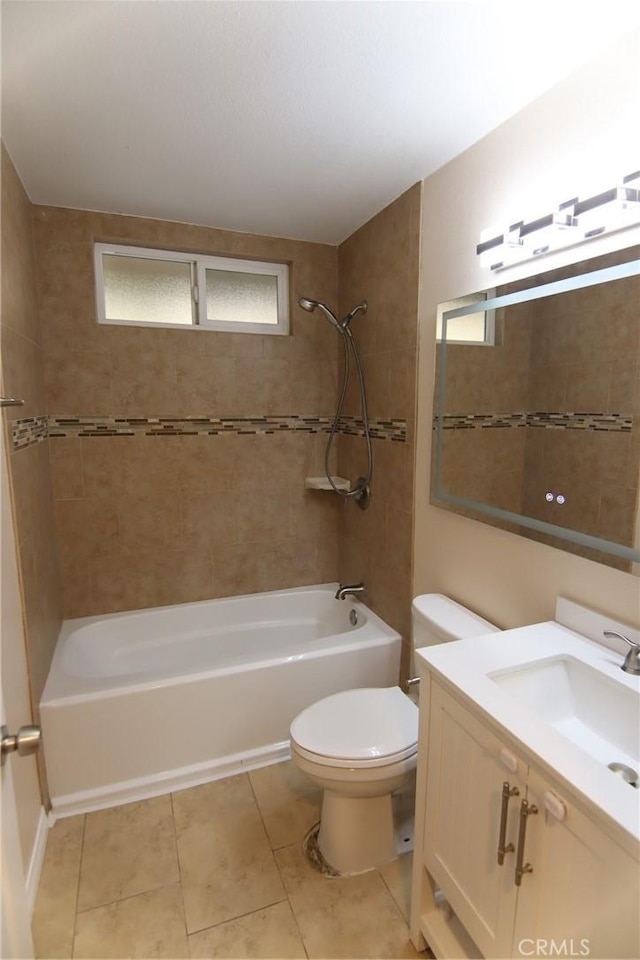 full bathroom featuring tile patterned flooring, shower / bathing tub combination, vanity, and toilet