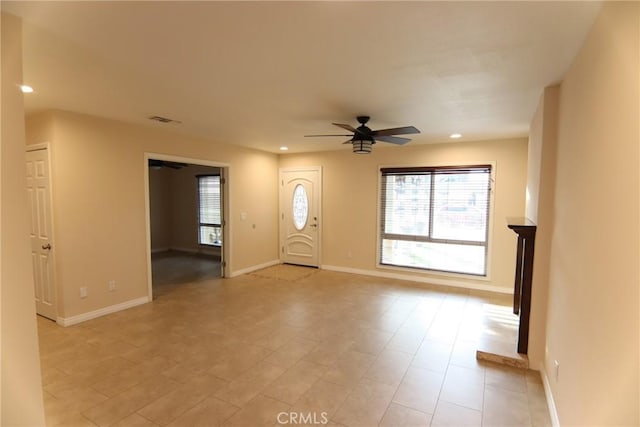 interior space with visible vents, recessed lighting, a ceiling fan, and baseboards