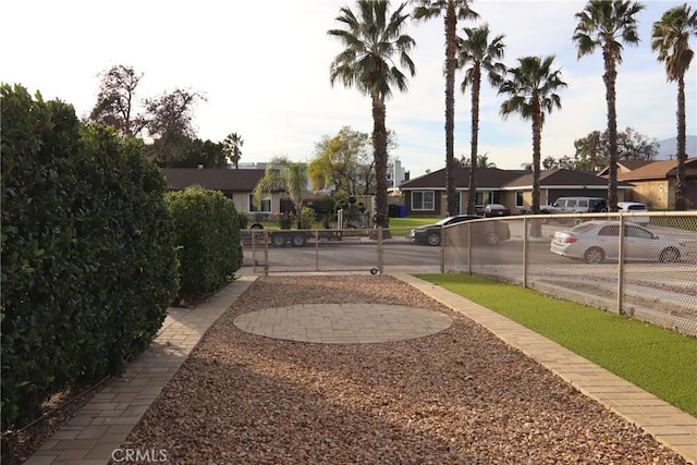 view of yard featuring fence and a residential view