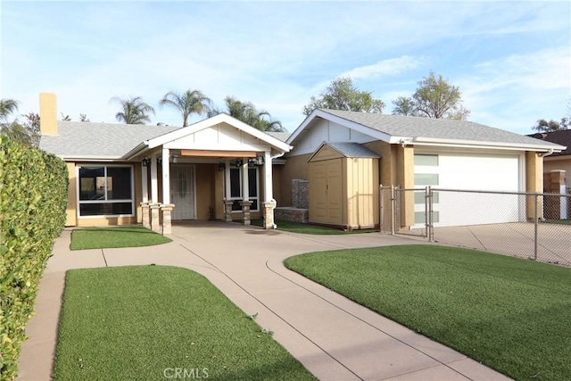 view of front of property with a garage and a front yard