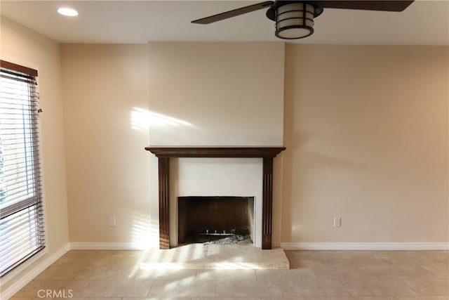 unfurnished living room with a fireplace, light tile patterned floors, recessed lighting, a ceiling fan, and baseboards