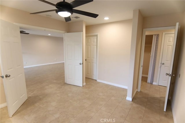 empty room featuring baseboards, visible vents, ceiling fan, and recessed lighting