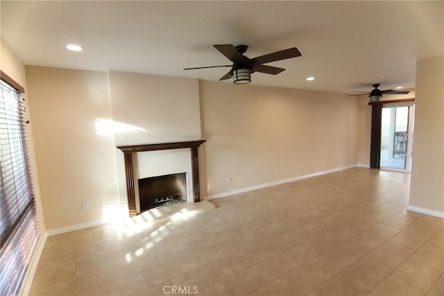 unfurnished living room featuring a fireplace with raised hearth, light tile patterned floors, recessed lighting, a ceiling fan, and baseboards