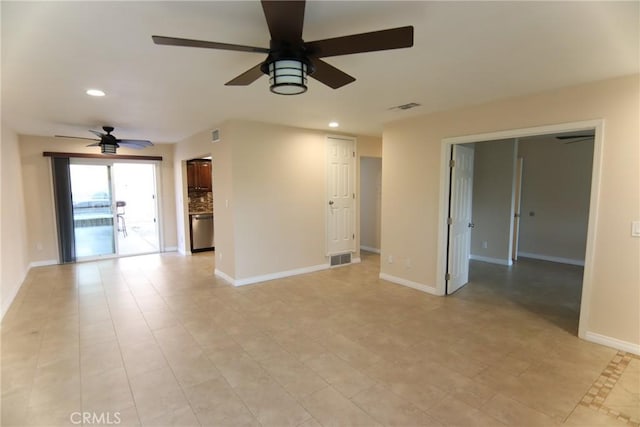 empty room with baseboards, visible vents, and recessed lighting