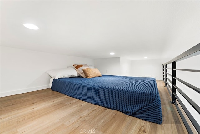 bedroom with wood-type flooring