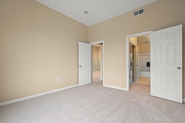 unfurnished bedroom with light carpet