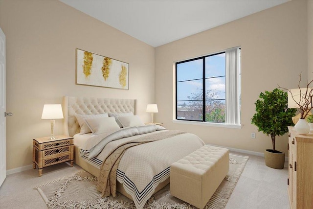 bedroom featuring light carpet