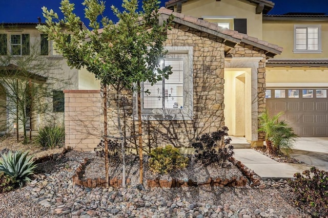 view of property exterior with a garage