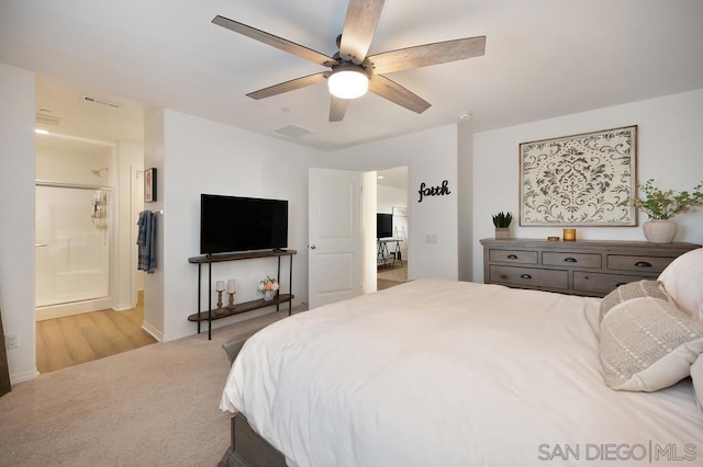 carpeted bedroom with ceiling fan and connected bathroom