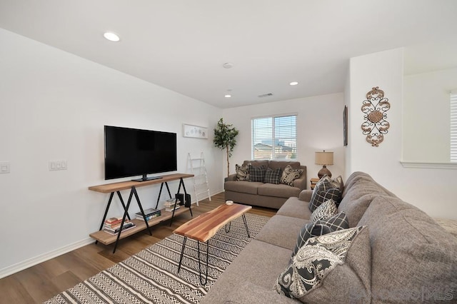 living room featuring dark wood-type flooring