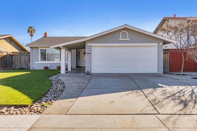 single story home featuring a garage and a front yard