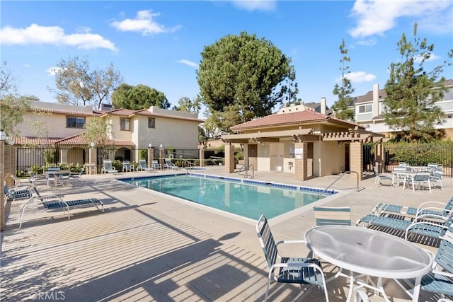 view of swimming pool with a patio