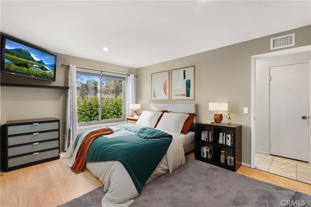 bedroom featuring light hardwood / wood-style floors