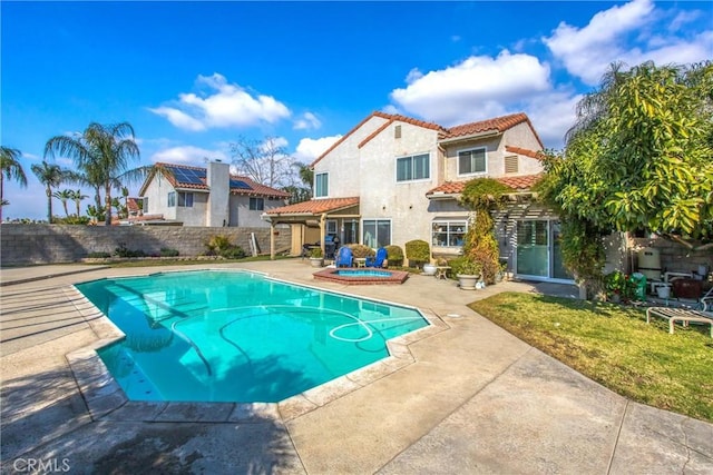 view of pool with a patio and an in ground hot tub