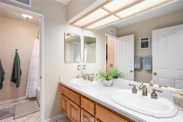 bathroom featuring shower / bath combination with curtain and vanity